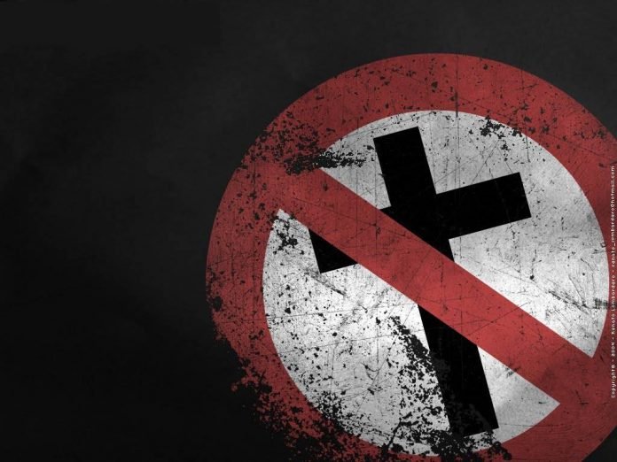 Placa que simboliza a intolerância religiosa contra os cristãos.