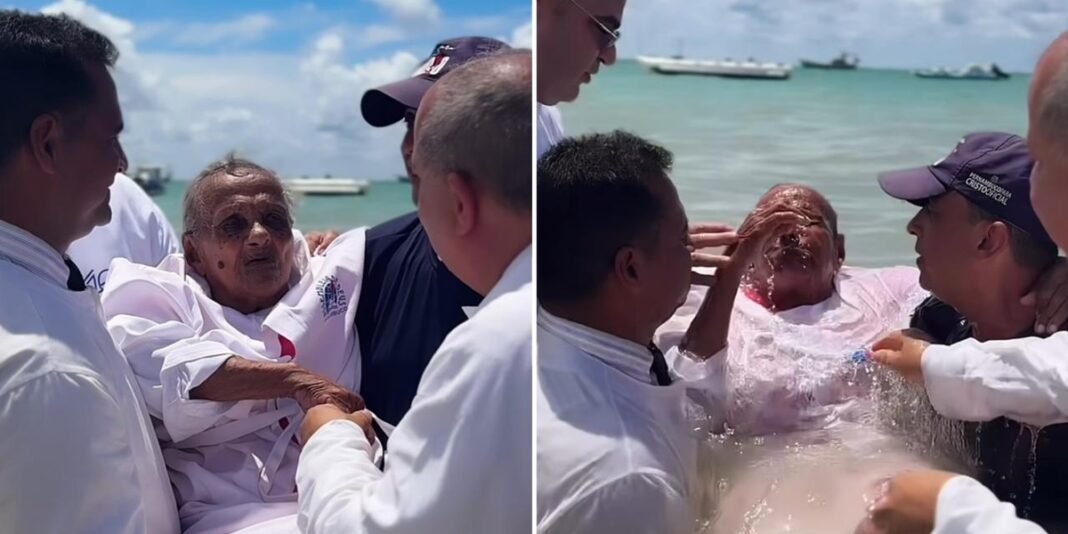 Idosa de 101 anos é batizada em praia de Pernambuco, cercada por fiéis emocionados.