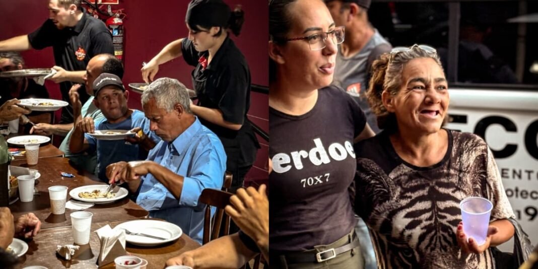 Pessoas em situação de rua participam de um rodízio de pizza promovido pela missão Sul, Missões e Graça.