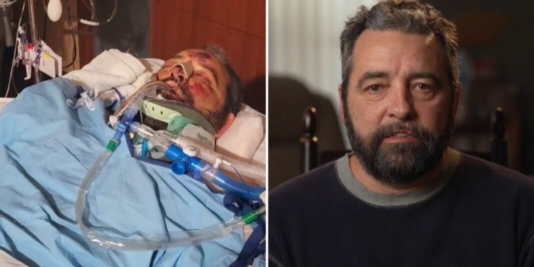 Kevin Smith sorri enquanto caminha com andador, apoiado pela esposa Tuesday Smith, após 25 cirurgias.