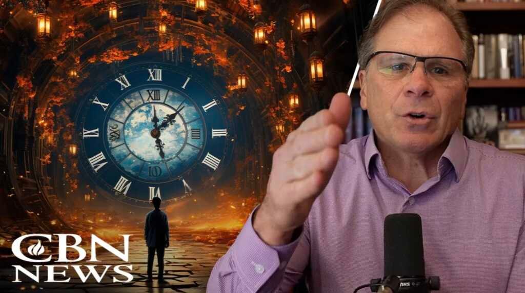 Frank Turek falando sobre a origem de Deus em um debate ou conferência.