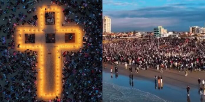 Culto ao amanhecer em Balneário Rincão atrai milhares Multidão reunida na orla de Balneário Rincão para culto ao amanhecer com cruz iluminada ao nascer do sol.