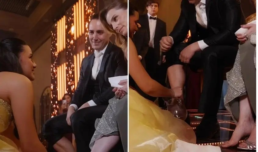 Adolescente de 15 anos ajoelhada lavando os pés dos pais em sua festa de debutante, um gesto de amor e gratidão que emocionou a todos.