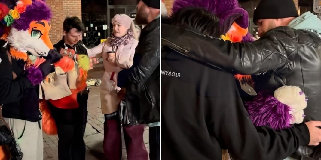 Evangelista Philip Renner em conversa com jovens fantasiados de animais nas ruas.