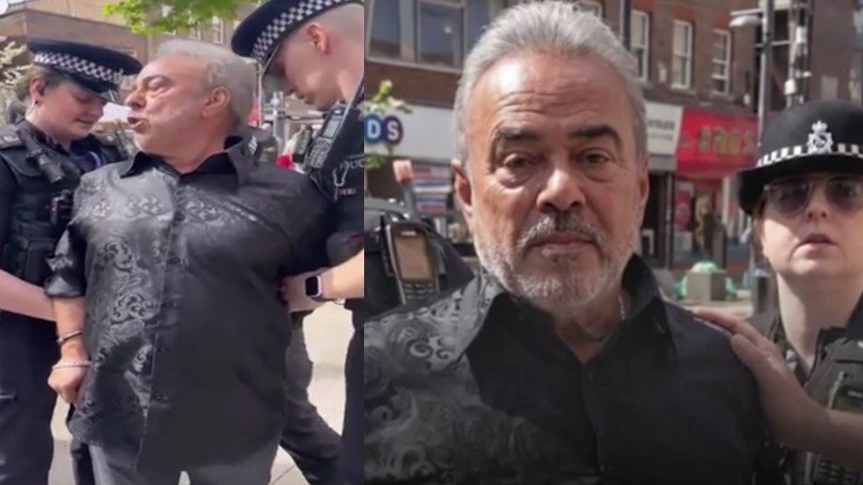 Pastor Steve Maile sendo algemado por policiais em rua na Inglaterra.
