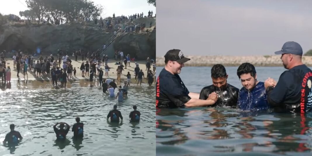 Centenas de pessoas sendo batizadas na praia Pirate's Cove, Califórnia, em evento da Harvest Church.